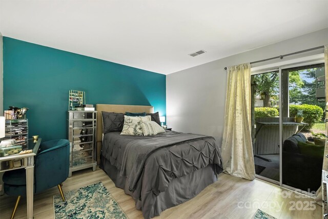 2533 Stockbridge Dr, Charlotte, NC 28210 - bedroom featuring wood finished floors and access to outside