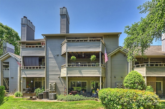 2533 Stockbridge Dr, Charlotte, NC 28210 - back of house with a chimney and cooling unit