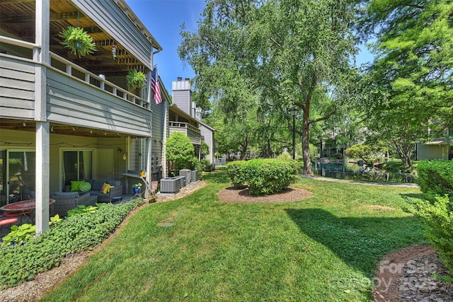 2533 Stockbridge Dr, Charlotte, NC 28210 - view of grassy yard featuring an outdoor hangout area and central AC