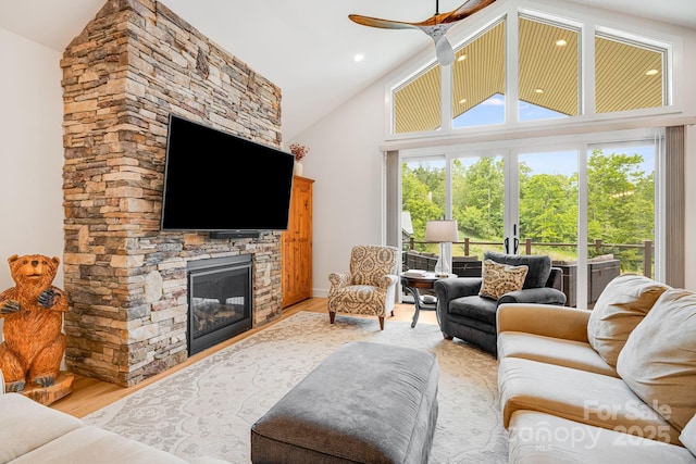 15 Ledgestone Dr, Fairview, NC 28730 - living area with ceiling fan, wood finished floors, a stone fireplace, and high vaulted ceiling