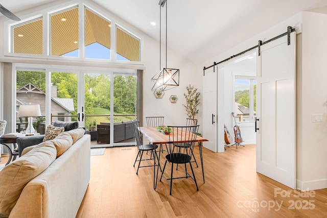 15 Ledgestone Dr, Fairview, NC 28730 - dining space featuring a barn door, light wood finished floors, high vaulted ceiling, and recessed lighting