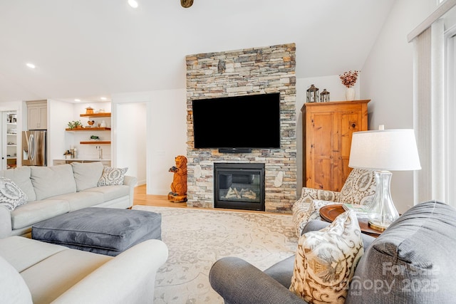 15 Ledgestone Dr, Fairview, NC 28730 - living room featuring wet bar, light wood-style flooring, a fireplace, and recessed lighting