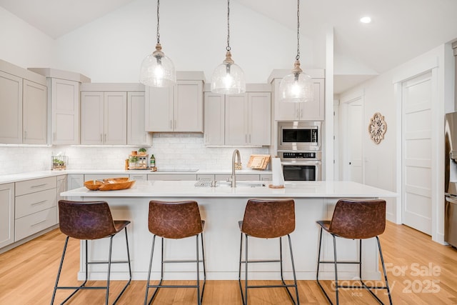 15 Ledgestone Dr, Fairview, NC 28730 - kitchen with appliances with stainless steel finishes, a sink, light countertops, decorative backsplash, and high vaulted ceiling