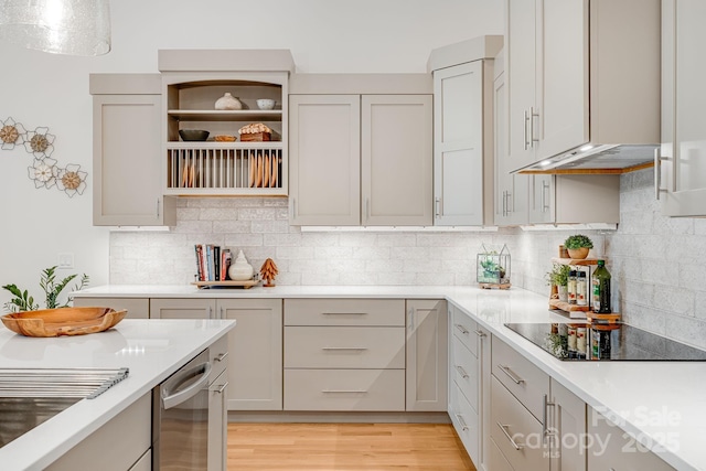 15 Ledgestone Dr, Fairview, NC 28730 - kitchen featuring black electric stovetop, light countertops, open shelves, and tasteful backsplash