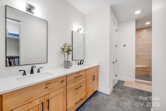 15 Ledgestone Dr, Fairview, NC 28730 - bathroom with double vanity, walk in shower, baseboards, and tile patterned flooring
