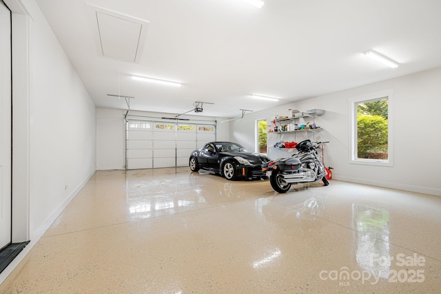 15 Ledgestone Dr, Fairview, NC 28730 - garage with baseboards and a garage door opener