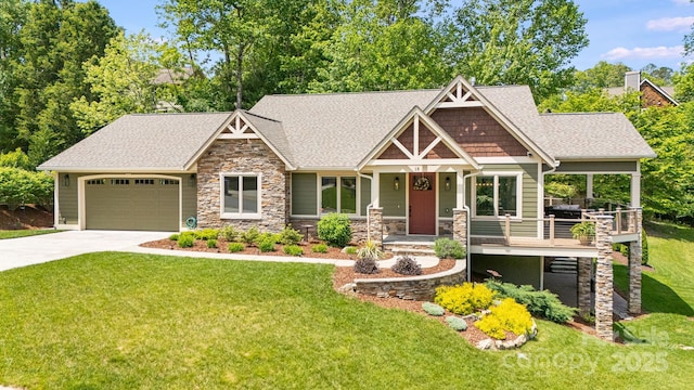 15 Ledgestone Dr, Fairview, NC 28730 - craftsman-style house with stone siding, an attached garage, a front yard, driveway, and a shingled roof