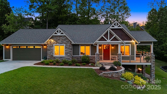 15 Ledgestone Dr, Fairview, NC 28730 - craftsman house with stone siding, driveway, a lawn, and an attached garage