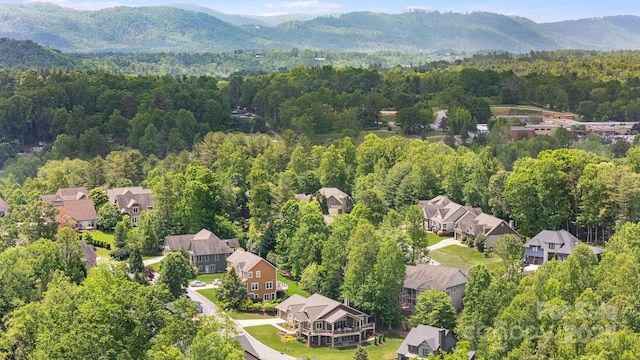 15 Ledgestone Dr, Fairview, NC 28730 - aerial view of residential area featuring a heavily wooded area and a mountain backdrop