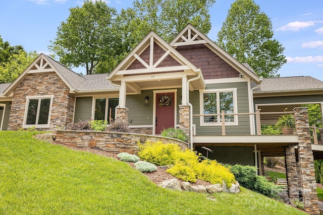 15 Ledgestone Dr, Fairview, NC 28730 - craftsman-style home featuring a front yard, stone siding, and a shingled roof
