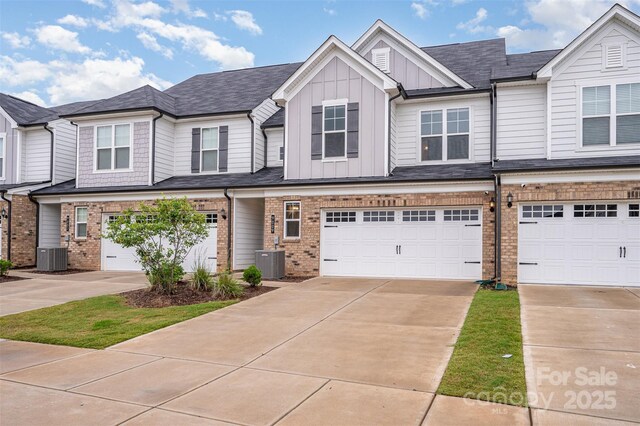 9009 Odell Corners Blvd NW, Concord, NC 28027 - multi unit property featuring board and batten siding, a garage, concrete driveway, and brick siding