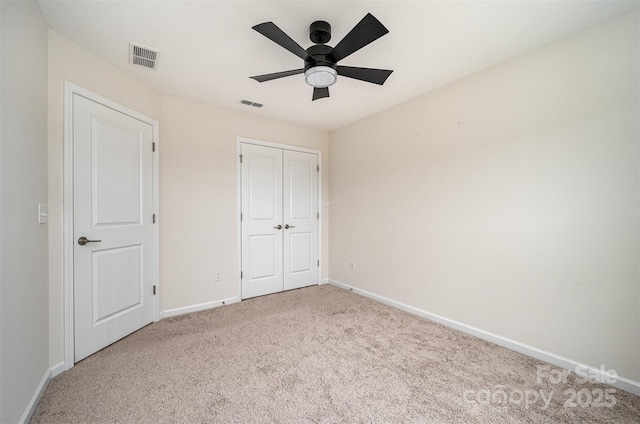 9009 Odell Corners Blvd NW, Concord, NC 28027 - unfurnished bedroom featuring carpet flooring, baseboards, a closet, and a ceiling fan