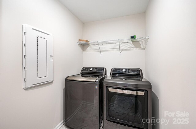9009 Odell Corners Blvd NW, Concord, NC 28027 - laundry area featuring electric panel, washer and dryer, and baseboards