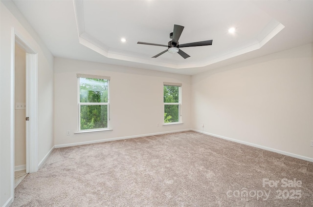 9009 Odell Corners Blvd NW, Concord, NC 28027 - empty room featuring a raised ceiling, healthy amount of natural light, ceiling fan, carpet, and recessed lighting