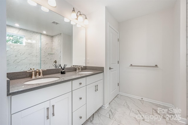 9009 Odell Corners Blvd NW, Concord, NC 28027 - bathroom featuring double vanity, a marble finish shower, marble finish floors, and baseboards