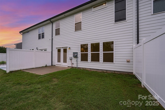 9009 Odell Corners Blvd NW, Concord, NC 28027 - back of house at dusk with a patio area