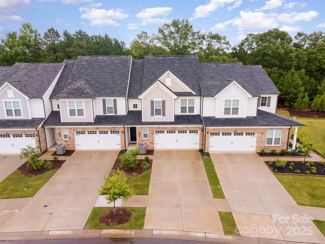 9009 Odell Corners Blvd NW, Concord, NC 28027 - multi unit property featuring board and batten siding, concrete driveway, a garage, and brick siding