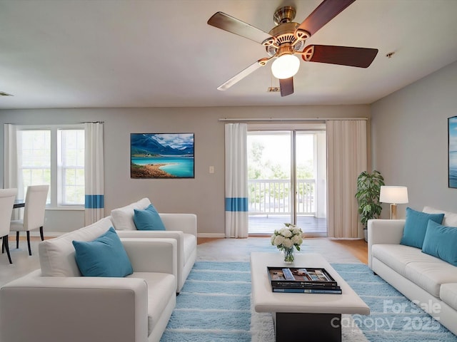 1023 Triece Ln, Charlotte, NC 28215 - living area featuring baseboards, ceiling fan, and light colored carpet