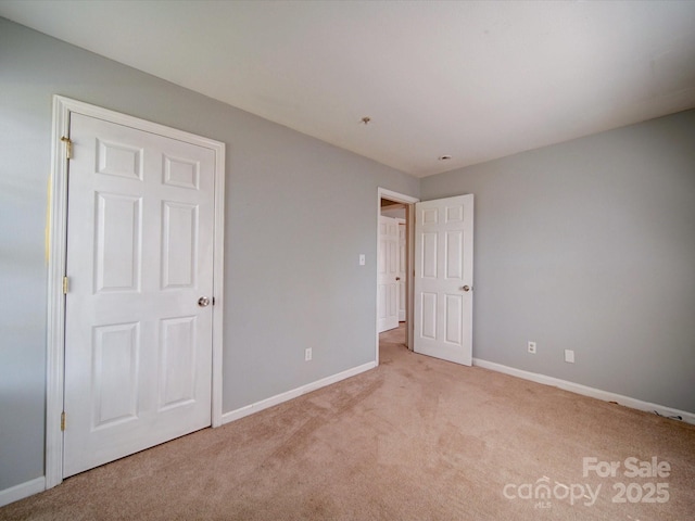 1023 Triece Ln, Charlotte, NC 28215 - unfurnished bedroom featuring carpet flooring and baseboards