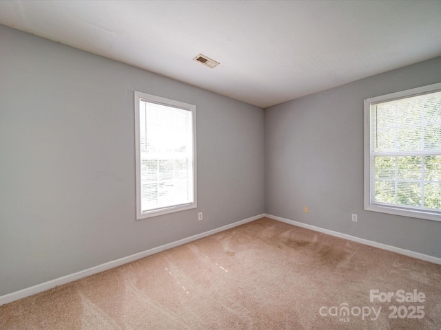 1023 Triece Ln, Charlotte, NC 28215 - carpeted empty room with baseboards
