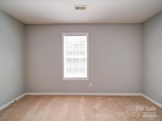 1023 Triece Ln, Charlotte, NC 28215 - spare room featuring carpet flooring and baseboards