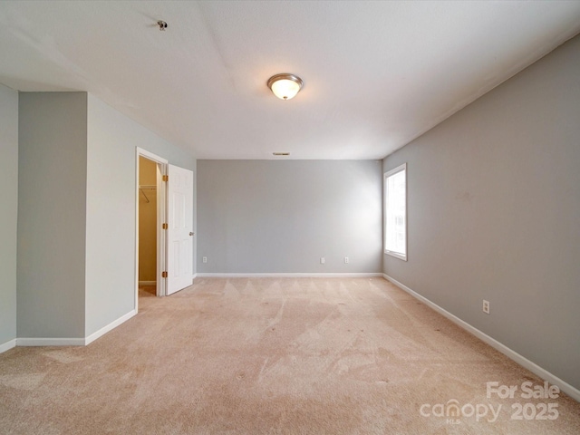 1023 Triece Ln, Charlotte, NC 28215 - spare room with light carpet, baseboards, and fire sprinkler in ceiling