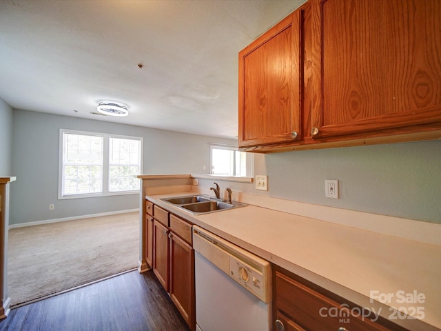 1023 Triece Ln, Charlotte, NC 28215 - kitchen with a sink, dishwasher, brown cabinetry, baseboards, and light countertops