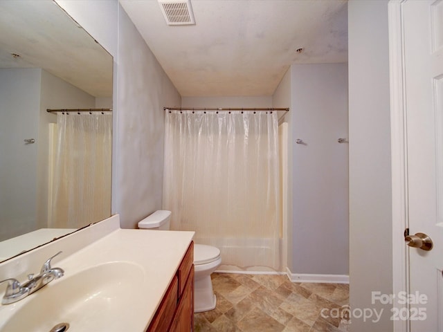 1023 Triece Ln, Charlotte, NC 28215 - bathroom with vanity, toilet, shower / bath combination with curtain, and baseboards