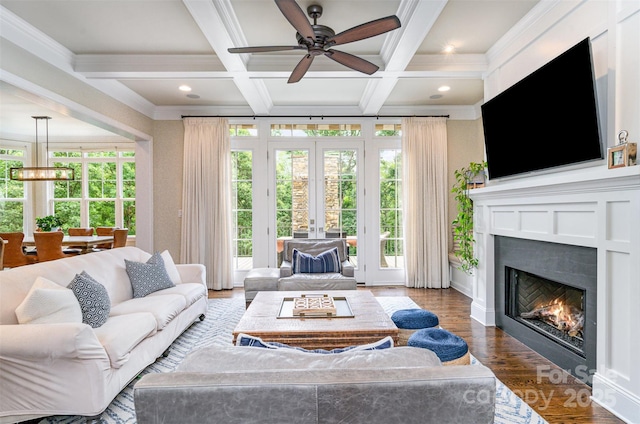 6873 Pine Moss Ln, Clover, SC 29710 - living room featuring coffered ceiling, ceiling fan, beamed ceiling, a warm lit fireplace, and wood finished floors