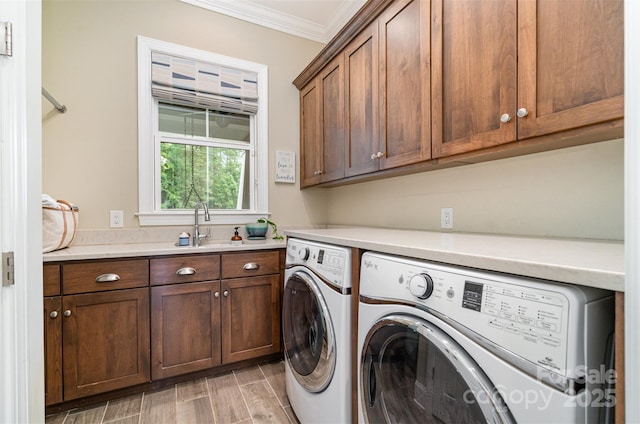 6873 Pine Moss Ln, Clover, SC 29710 - washroom featuring cabinet space, washer and dryer, crown molding, and light wood-style flooring