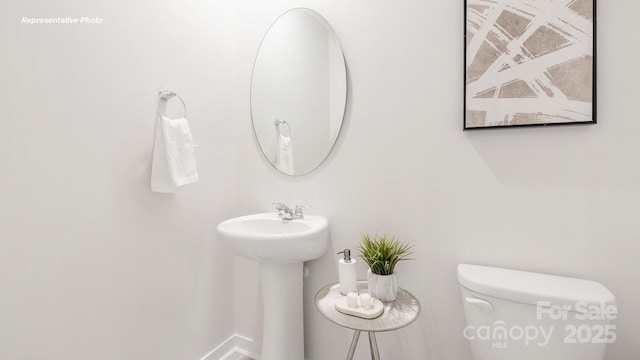 3734 Coleman Dr, Charlotte, NC 28215 - half bathroom featuring toilet and a sink
