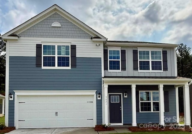 3734 Coleman Dr, Charlotte, NC 28215 - view of front of home with driveway, an attached garage, and a porch