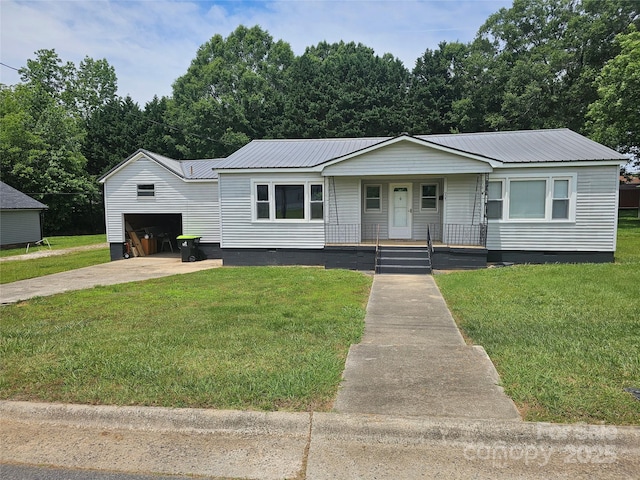 905 Klondale St, China Grove, NC 28023 - view of front of home featuring crawl space, covered porch, metal roof, and a front yard