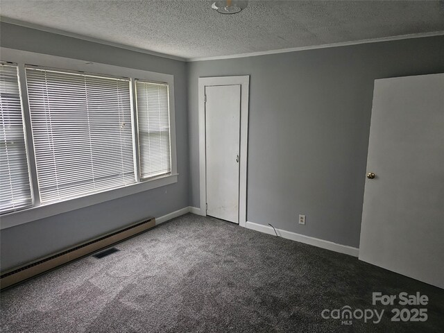 905 Klondale St, China Grove, NC 28023 - unfurnished room with carpet floors, a baseboard heating unit, a textured ceiling, ornamental molding, and baseboards
