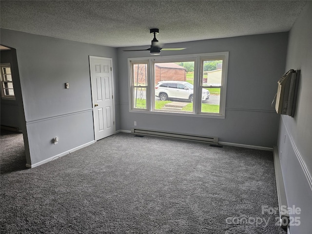 905 Klondale St, China Grove, NC 28023 - spare room with carpet flooring, a baseboard heating unit, a textured ceiling, a ceiling fan, and baseboards