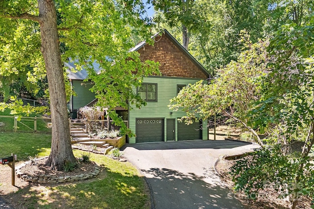 6 Woodland Rd W, Asheville, NC 28806 - view of front of home featuring asphalt driveway and a garage