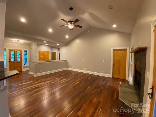 6 Woodland Rd W, Asheville, NC 28806 - unfurnished living room featuring ceiling fan, a fireplace with raised hearth, dark wood finished floors, baseboards, and recessed lighting