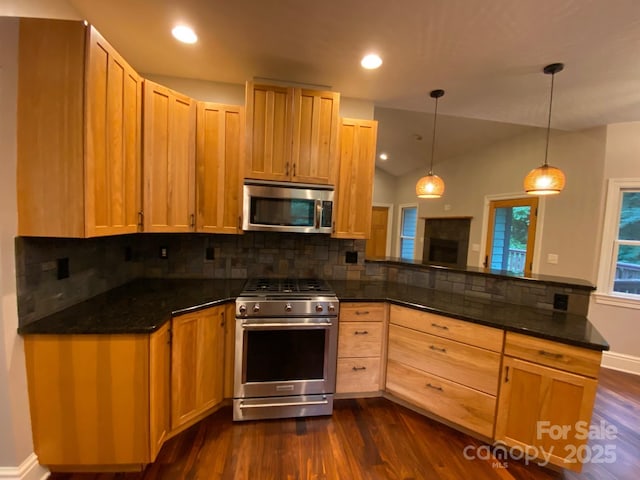 6 Woodland Rd W, Asheville, NC 28806 - kitchen featuring stainless steel appliances, a peninsula, dark wood-type flooring, tasteful backsplash, and recessed lighting