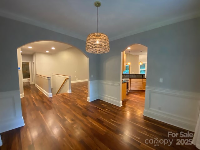 6 Woodland Rd W, Asheville, NC 28806 - unfurnished room with dark wood-style flooring, arched walkways, a wainscoted wall, and recessed lighting