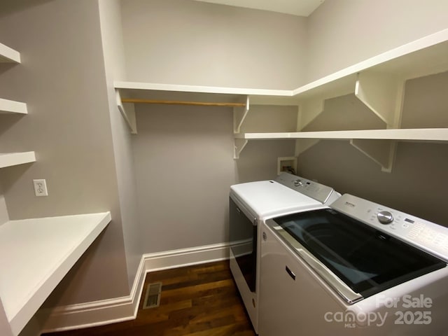 6 Woodland Rd W, Asheville, NC 28806 - washroom with washing machine and clothes dryer, dark wood-style flooring, and baseboards