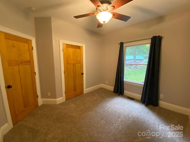 6 Woodland Rd W, Asheville, NC 28806 - unfurnished bedroom with carpet floors, baseboards, and a ceiling fan