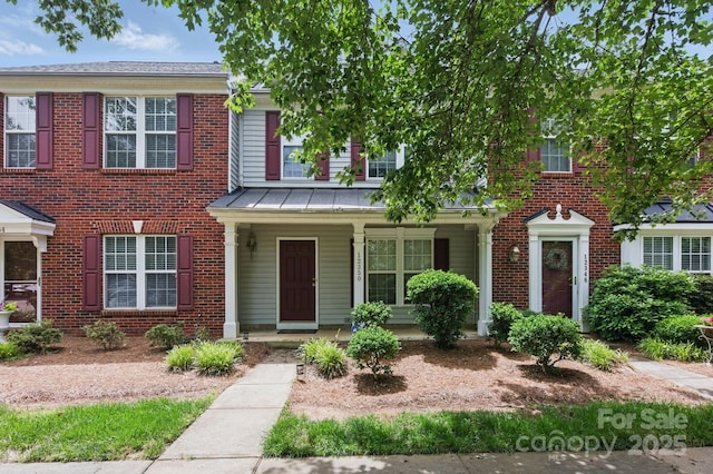 12350 Swan Wings Pl, Huntersville, NC 28078 - multi unit property with a standing seam roof, covered porch, brick siding, and metal roof