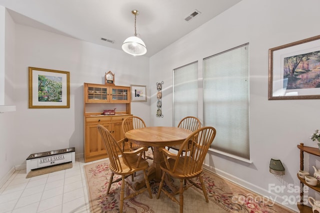 12350 Swan Wings Pl, Huntersville, NC 28078 - dining space featuring baseboards and light tile patterned flooring