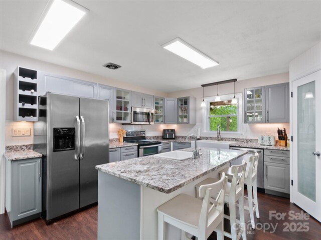 391 Ellen Ave, Canton, NC 28716 - kitchen featuring appliances with stainless steel finishes, gray cabinets, and a sink