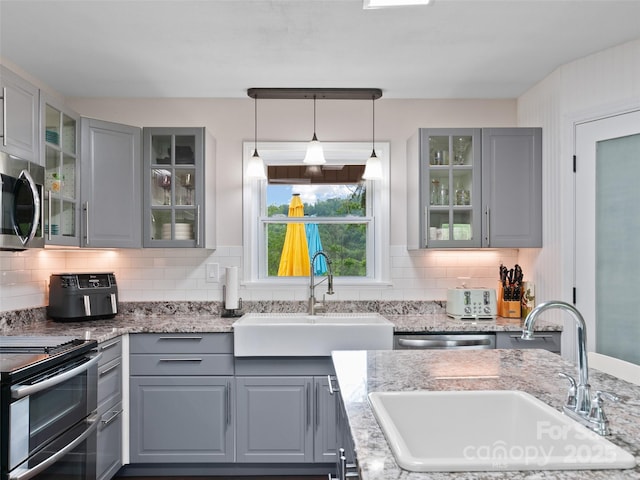 391 Ellen Ave, Canton, NC 28716 - kitchen featuring gray cabinetry, a sink, and appliances with stainless steel finishes