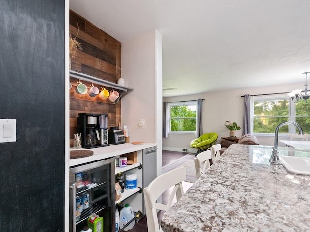 391 Ellen Ave, Canton, NC 28716 - kitchen featuring beverage cooler, a sink, and a chandelier