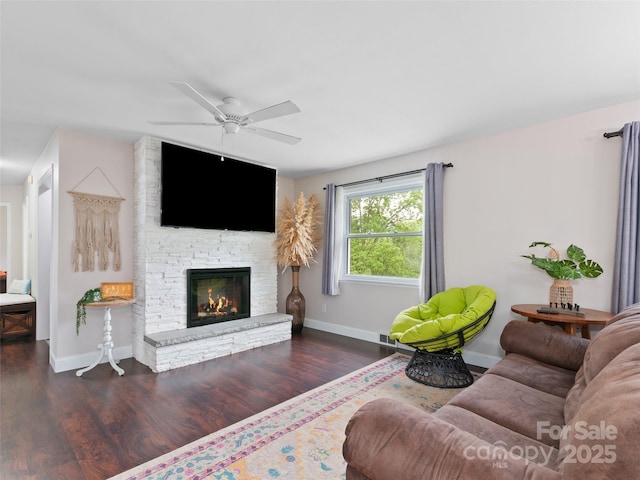 391 Ellen Ave, Canton, NC 28716 - living room featuring wood finished floors, a ceiling fan, baseboards, and a stone fireplace