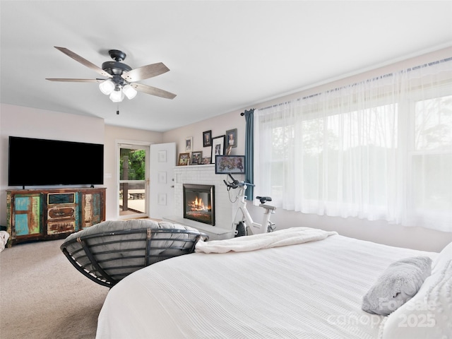 391 Ellen Ave, Canton, NC 28716 - bedroom featuring a fireplace, carpet, and a ceiling fan
