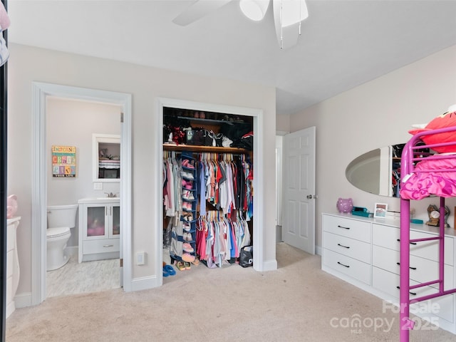 391 Ellen Ave, Canton, NC 28716 - carpeted bedroom with a closet, a ceiling fan, connected bathroom, and baseboards