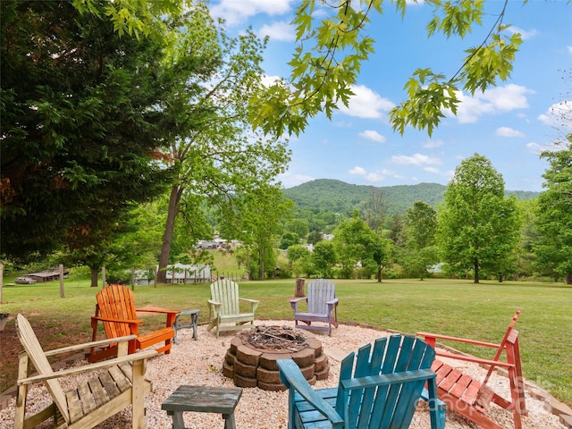 391 Ellen Ave, Canton, NC 28716 - view of patio featuring a fire pit, a mountain view, and a view of trees